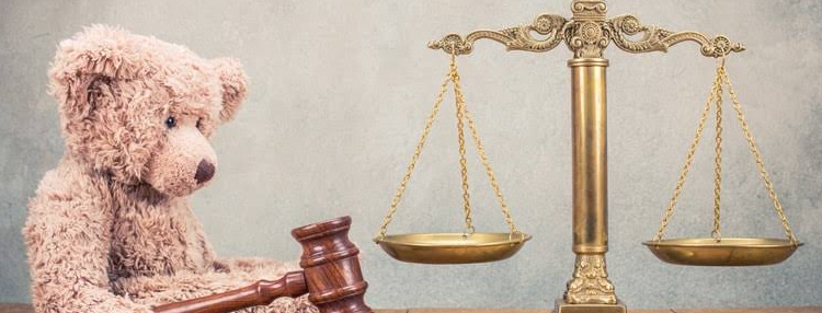 Teddy bear and legal scales